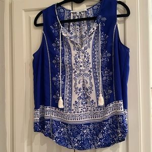 Sleeveless blue and white tunic with tie at chest